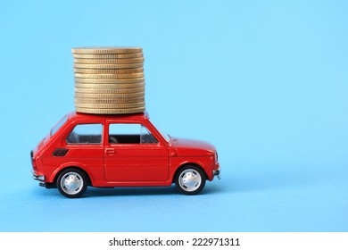 Coin Stack On Red Miniature Car