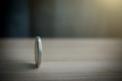 Coins Always Have 2 Side Idiom Idea Concept, A Thai Coin Rolling On Table With Blurred Background Sunshine Strong Ligthing
