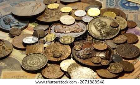 Coins, banknotes, commemorative medals, from different countries. Copper, silver, gold.