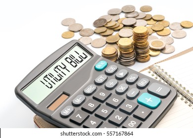 coins and calculator with financial conceptual text.
