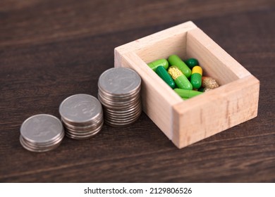 Coins And Capsules For The Price Of Western Medicine