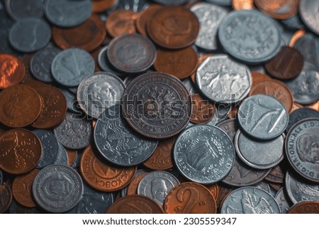 Coins from different countries of the world, in the foreground a coin of Tsarist Russia 5 kopecks copper coin