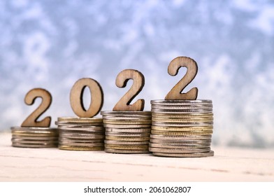 Coins And Figures 2022. Banner 2022. Money Stacked In Columns.