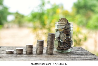 Coins In Glass Bottles. Coins Are Set Up Orderly, Business Growth, Frugality, Financial Savings.