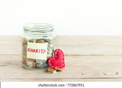 Coins In Glass Jar With Charity Label. Money Savings, Charity And Donation Concept, Copy Space.