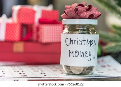 Coins In Glass Jar With The Word Christmas Money Saving