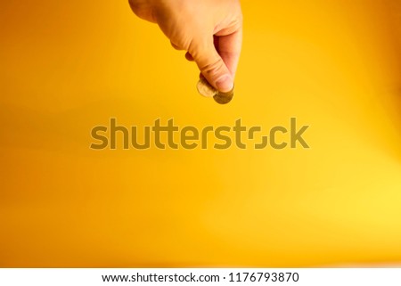 Coins in the hand. The concept of cheaper currency