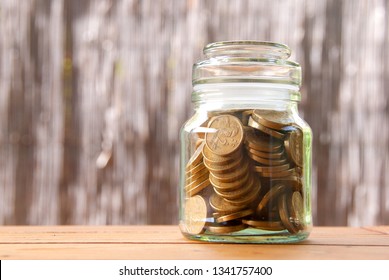 Coins in a jar, concept save money. Australian two dollar coins.