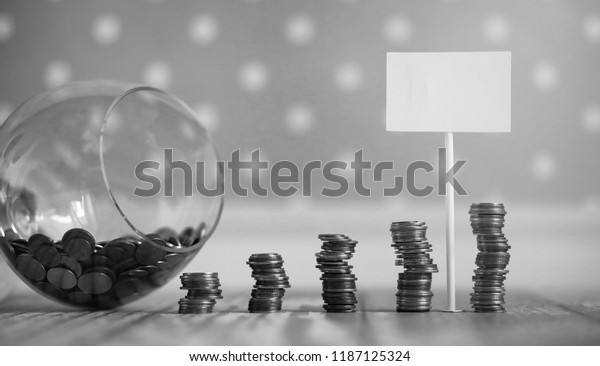 Coins in a jar on the floor.
Accumulated coins on the floor. Pocket savings in
piles.