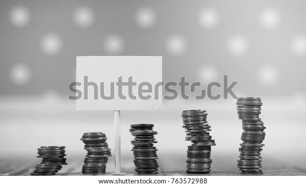 Coins in a jar on the floor.
Accumulated coins on the floor. Pocket savings in
piles.