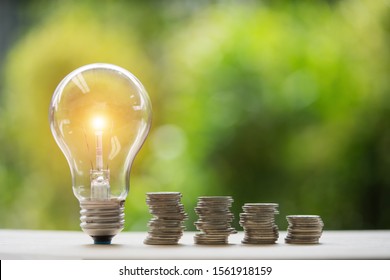 coins and light bulb. concept saving money.