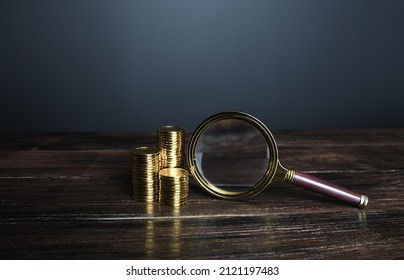 Coins And Magnifying Glass. Investigating Capital Origins. Search For Investments, Fund New Business Projects. Deposit Or Loan Terms Conditions. Accounting Audit. Cost Cutting, Budget Optimization.