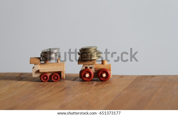 Coins money on wood toy truck\
