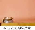 Coins, money and stack of savings or cash, asset and funds for mockup and banking. Minimal wage, poverty and salary for growth and budget to pay bills and costs, buy and accounting finance earning