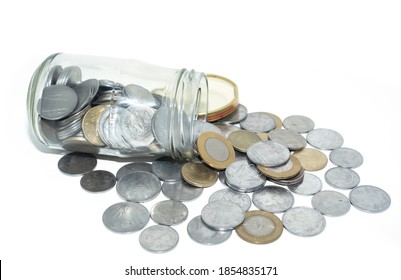 Coins Pouring Out Of Glass Jar Isolated On White Background. ( Indian Rupee Coin)