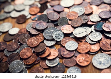 Coins. Quarters, pennies and nickels.  Financial concept