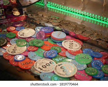 Coins In A Sliding Machine (coin Pusher) (multiple Colors) At The Fairground