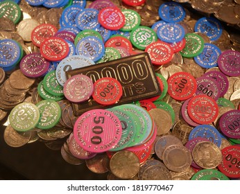 Coins In A Sliding Machine (coin Pusher) (multiple Colors) At The Fairground