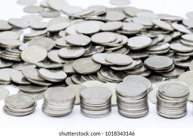 Coins stack isolated on white background selective focus.