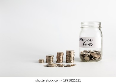 Coins Stacked Up Next To An Empty Jar With A Label On For Pension Fund. Pension, Financial, Savings, Economy, Investment Concept