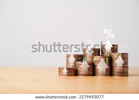 Coins stacking with white up arrow and percentage for increasing interest rate and inflation concept.
