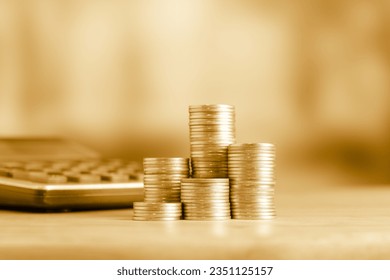 Coins stacks and coin on golden background, business and finance concept idea. - Powered by Shutterstock