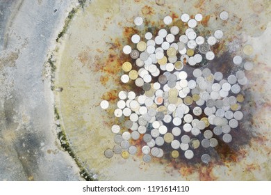 Coins In A Wishing Well Top View.