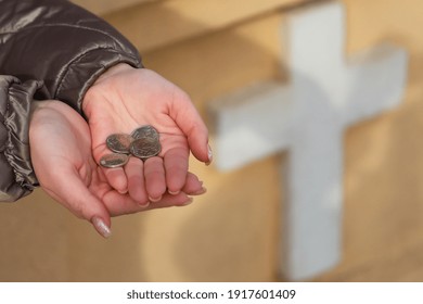 Coins In Womens Palms. Financial Hardship Concept. Background