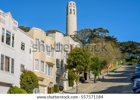 Coit Tower - A close-up view of Coit Tower in Telegraph Hill neighborhood, as seen from steep Filbert Street, San Francisco, California, USA.