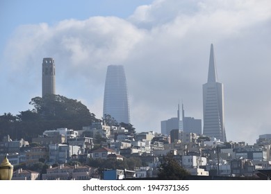 Coit Tower With A Foggy San Francisco City Skyline Behind