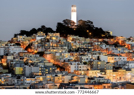 Coit Tower on Telegraph Hill as seen from Russian Hill at Dusk. San Francisco, California, USA.