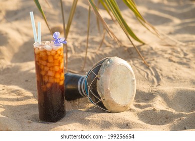 Coke Cocktail Still Life On  A Sunny Beach