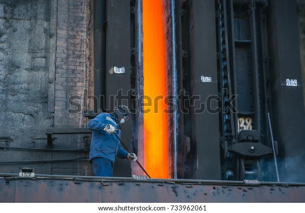 Coke furnace.\
Production of coke. Steel works. The person loads coke in the\
furnace. The heated coal.\
NLMK.