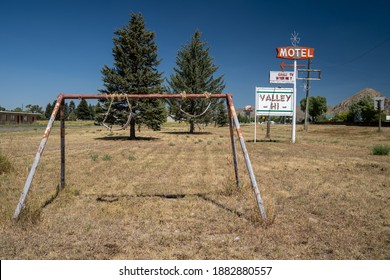 Cokeville, Wyoming - August 6, 2020: Swingset And Playground At An Old Abandoned Seedy Motel