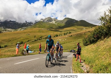 Col de la Madeleine, France - August 24, 2020: Sebastian Schonberger and Nikias Arndt riding in a group of cyclists on the road to Col de la Madeleine during the 3rd stage of Criterium du Dauphine