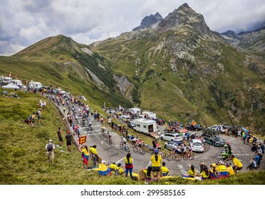 COL DU GLANDON, FRANCE - JUL 24: The peloton riding in a beautiful curve at Col du Glandon in Alps during the stage 19 of Le Tour de France on July 24, 2015.