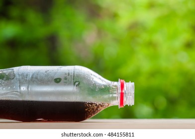 Cola in bottle.