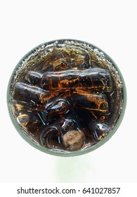 Cola Brown Carbonated Drink In Glass On Top View, Coke Or Pepsi In Glass.