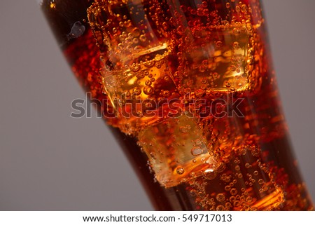 cola with ice closeup