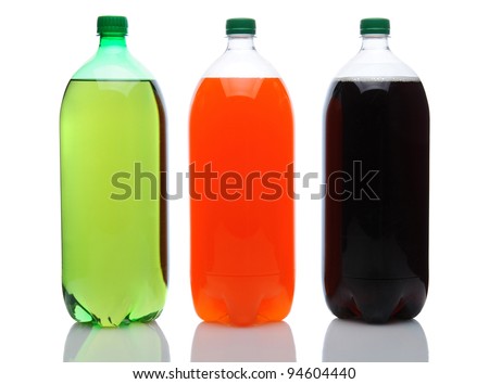 Cola, Lemon Lime and Orange two liter soda bottles on a white background with reflection.
