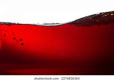 Cola texture on white background,Side view background of refreshing cola flavored soda with bubbles isolated on white