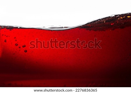 Cola texture on white background,Side view background of refreshing cola flavored soda with bubbles isolated on white