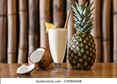 Piña Colada With Coconut And Pineapple In The Background