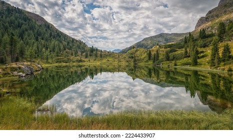 the Colbricon lakes in summer with the mountain reflected on the water - Lagorai chain, Trento province,Trentino Alto Adige, northern Italy - Europe - - Shutterstock ID 2224433907