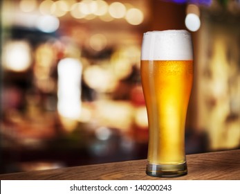 Cold Beer Glass On Bar Or Pub Desk