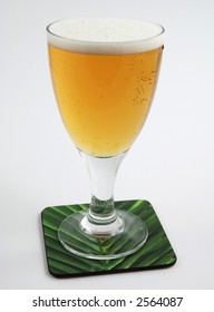 Cold beer on coaster