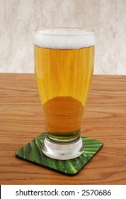 Cold beer on coaster
