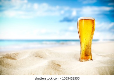 Cold Beer On Sand And Beach Background 