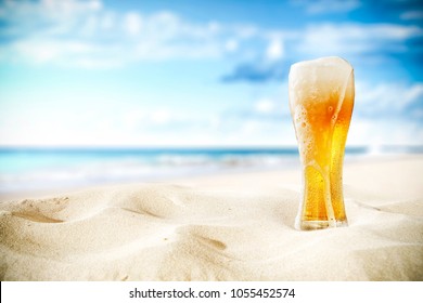 Cold Beer On Sand And Beach Background 