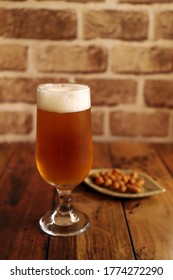 Cold Beer Poured Into A Glass And Snack Nuts, Image Of Beer Hall